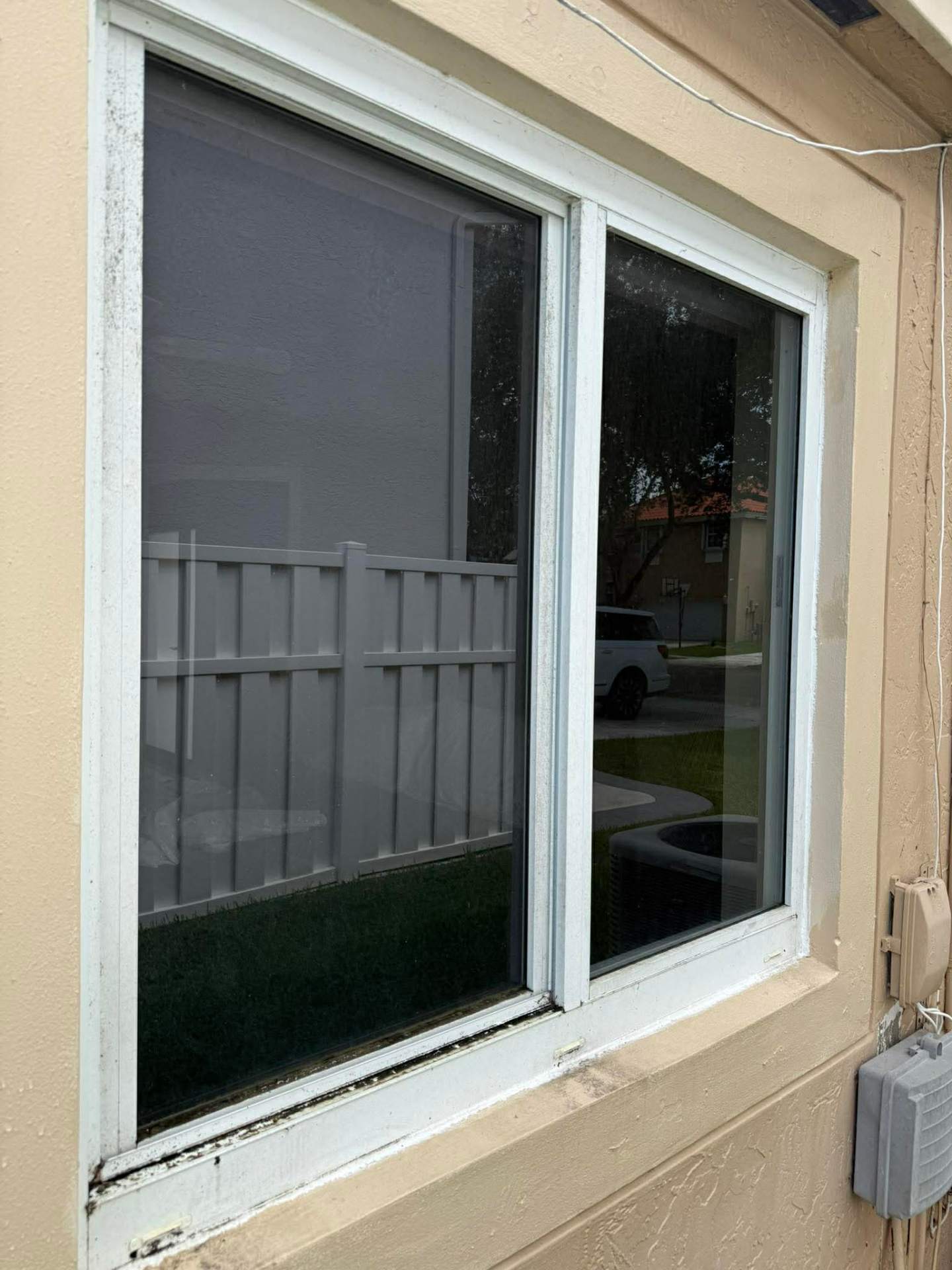 Dirty bathroom window with buildup